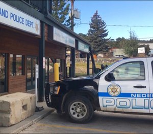 FILE - This Oct. 13, 2016 file photo shows the exterior of the police station in Nederland, Colo. where David Ansberry left a homemade bomb that failed to detonate. On Friday, Jan. 25, 2019 Ansberry was sentenced to 27 years in prison after a judge concluded the device was left to avenge the killing of a friend in 1971 by the town marshal and should be treated as an act of terrorism. (AP Photo/Sadie Gurman, File)