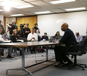 Denver Police Department Chief Robert White, right, responds to questions during a news conference in Denver, Thursday, Jan. 29, 2015, about the death of a 17-year-old woman who was killed after she allegedly hit and injured a Denver Police Department officer while driving a stolen vehicle early Monday in a northeast Denver alley.