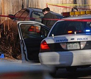 Denver police shot and killed a female suspect early Monday, Jan. 26, 2015, after they said she drove a stolen car at officers, hitting one of them in the leg.
