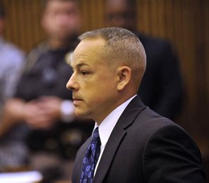In this June 18, 2013 file photo, Detroit police officer Joseph Weekley stands in Judge Cynthia Hathaway's courtroom at the Frank Murphy Hall of Justice in Detroit. (AP Image)
