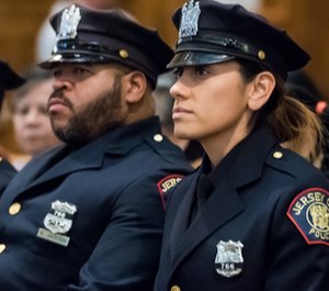 Officers Raymond Sanchez, (not pictured), Kendric Jackson, right, and Mariela Fernandez to the rank of detective following their heroic actions during a shooting at a kosher deli on Dec.10, 2019. (Photo/TNS)