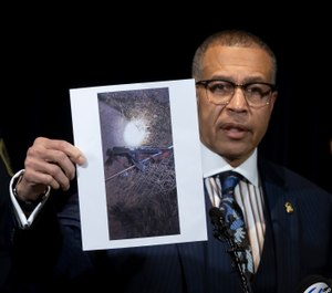 Detroit Police Chief James Craig shows a photograph of an "assault-type weapon" used by the suspect as he speaks to the media at Detroit Public Safety Headquarters. (Photo/AP)