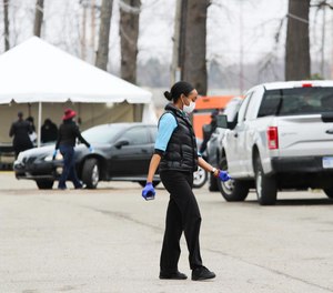 Drive-thru COVID-19 testing began at the former Michgian State Fairgrounds on Friday. Duggan says he wants to expand testing criteria so more people can be tested onsite. (Photo/TNS)