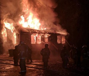Dispatcher Barbara Hughes was working when she took a 911 call reporting a blaze in the area where she lives.