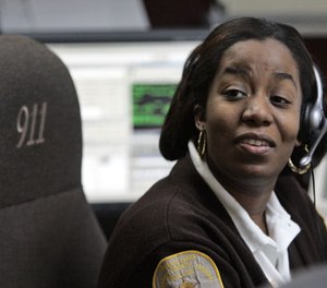 Brunswick County Dispatcher and Chief of Communications Joy Seward, man's the desk in her office in Lawrenceville, Va., Thursday, Jan. 29, 2009.