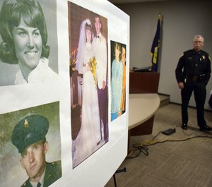 Photos of Linda and Clifford Bernhardt, who were killed in 1973, are displayed at a press conference at the Yellowstone County administrative offices in Billings, Montana on Monday, March 25, 2019. (AP Photo/Matthew Brown)