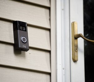 In this Tuesday, July 16, 2019, photo, a Ring doorbell camera is seen at a home in Wolcott, Conn. (AP Photo/Jessica Hill)