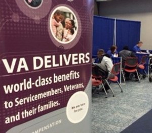 Veterans fill out VA paperwork.