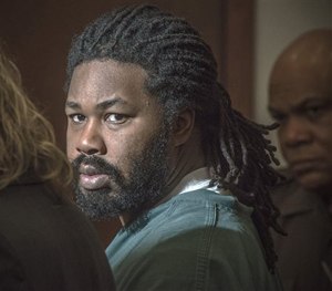 In this Nov. 14, 2014 file photo Jesse Matthew Jr., right, looks toward the gallery while appearing in court in Fairfax, Va.