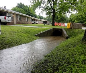 In this May 25, 2015 photo is the box culvert where Claremore Fire Department Capt. Jason Farley was trapped and drowned on Saturday in Tulsa, Okla.
