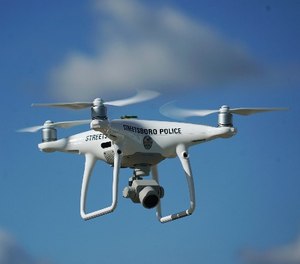 In this Oct. 16, 2017 photo, the Streetsboro police department's first drone flies in Streetsboro, Ohio.