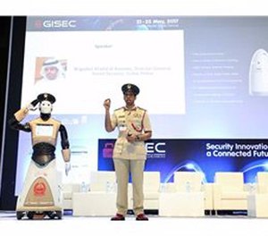A police spokesperson shows off the new robot officer.