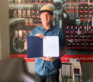 Santa Cruz Central Fire Protection District Firefighter Dustin Marty was presented a letter of commendation by the district's board of directors for his off-duty rescue of 10 surfers. (Photo/Central Fire Protection District of Santa Cruz County)