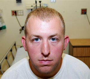 Officer Darren Wilson during his medical examination after he fatally shot Michael Brown, in Ferguson, Mo.