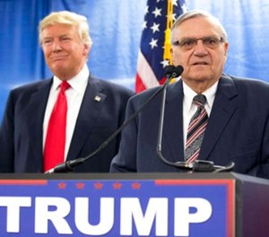 In this Jan. 26, 2016, file photo, then-Republican presidential candidate Donald Trump is joined by Joe Arpaio, the then sheriff of metro Phoenix, during a news conference in Marshalltown, Iowa.