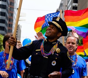 A San Francisco police officer marches in the 2018 Pride parade.