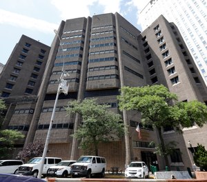 This July 1, 2019 photo shows the Manhattan Correctional Center, in New York. (AP Photo/Richard Drew)
