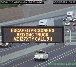 This photo from an Arizona Department of Transportation remote camera shows a digital sign over Interstate 10 in the Phoenix metropolitan area that seeks the public's help in locating escaped murder suspects,Wednesday, Aug. 28, 2019.
