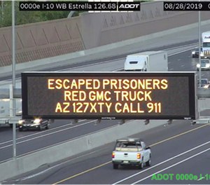 This photo from an Arizona Department of Transportation remote camera shows a digital sign over Interstate 10 in the Phoenix metropolitan area that seeks the public's help in locating escaped murder suspects,Wednesday, Aug. 28, 2019. (Arizona Department of Transportation via AP)