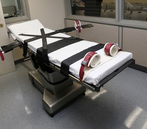 This Oct. 9, 2014, file photo shows the gurney in the the execution chamber at the Oklahoma State Penitentiary in McAlester, Okla.