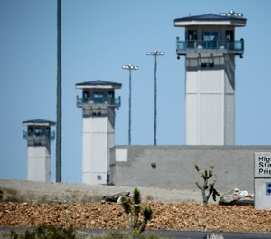In this April 15, 2015 file photo guard towers are seen at High Desert State Prison in Indian Springs, Nev.