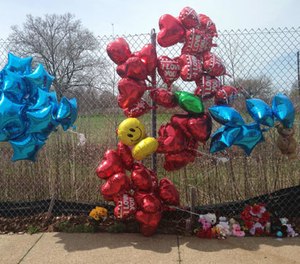 A makeshift memorial sits along a fence Monday, April 17, 2017, near where Robert Godwin Sr., was killed in Cleveland.