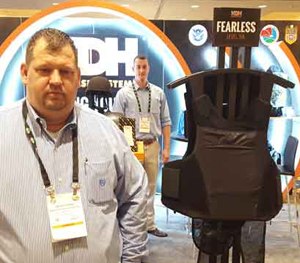 Wayne Grimes (left) and Michael Silva display the new KDH Fearless Concealment Carrier at SHOT Show 2016. (PoliceOne Image)