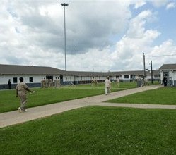 Inmates walk through the court yard to the dorms at Western Kentucky Correctional, in Fredonia, Ky.