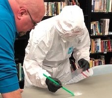 Fentanyl response training for authorized responders includes proper donning and doffing of protective equipment in addition to safe evidence collection practical exercises. (Photo/KDOC)