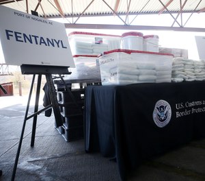 A display of the fentanyl and meth that was seized by Customs and Border Protection officers over the weekend at the Nogales Port of Entry is shown during a press conference on Thursday, Jan. 31, 2019, in Nogales, Ariz. U.S. Customs and Border Protection officials announced Thursday their biggest fentanyl bust ever, saying they captured nearly 254 pounds (114 kilograms) of the deadly synthetic opioid from a secret compartment inside a load of Mexican produce heading into Arizona. (Mamta Popat/Arizona Daily Star via AP)