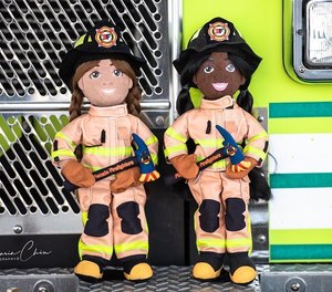 Ember, left, and Molly come with protective gear and an axe, plus an inspirational quote from a real female firefighter.