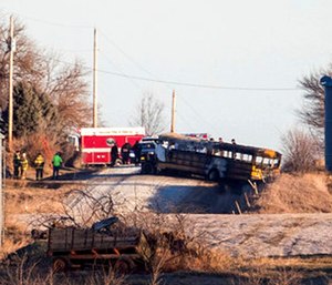 The bus was engulfed in flames when firefighters arrived. (Chris Machian/Omaha World-Herald via AP)