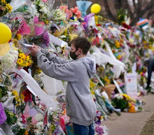 After every mass shooting, there is an outpouring of public grief, like this impromptu memorial wall at the scene of the Boulder supermarket shooting.