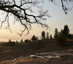 Charred ground and only a few pieces are the remains of the historic Fountaingrove Round Barn Wednesday, Oct. 11, 2017, in Santa Rosa, Calif.