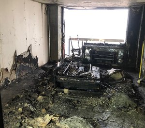 This photo shows the aftermath of an apartment building fire that injured 22 people, including four firefighters and a newborn, in Manhattan on Tuesday morning. The FDNY said the fire started in an apartment where the door was left open and spread throughout the building, and urged residents close their doors while escaping a fire.