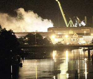 Smoke rises from a dry dock as fire crews respond Wednesday, May 23, 2012 to a fire on the USS Miami SSN 755 submarine at the Portsmouth Naval Shipyard. (Photo/AP)