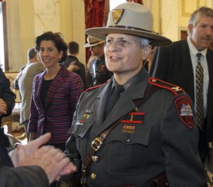 Rhode Island Gov. Gina Raimondo, left, stands beside Ann C. Assumpico, whom she named as the 13th Superintendent of the Rhode Island State Police, during a ceremony Thursday, Nov. 3, 2016, at the State House in Providence. R.I.