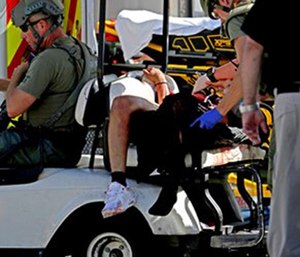 Medical personnel tend to a victim following a shooting at Marjory Stoneman Douglas High School in Parkland, Fla. (John McCall/South Florida Sun-Sentinel via AP)