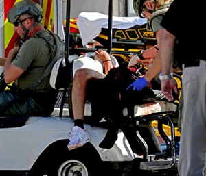 Medical personnel tend to a victim following a shooting at Marjory Stoneman Douglas High School in Parkland, Fla.