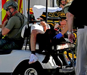 Medical personnel tend to a victim following a shooting at Marjory Stoneman Douglas High School in Parkland, Fla.