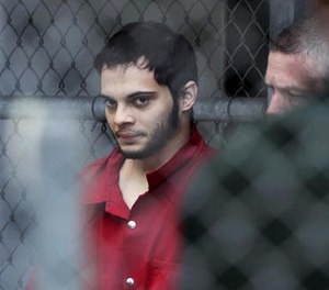 In this Jan. 9, 2017, file photo, Esteban Santiago is taken from the Broward County main jail as he is transported to the federal courthouse in Fort Lauderdale, Fla. Just weeks before a gunman opened fire at Fort Lauderdale's airport, he walked into an FBI office in Alaska telling authorities the government was controlling his mind and that he was having terroristic thoughts.