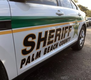 A Palm Beach County Sheriff's deputy was pinned between two vehicles as a suspect tried to flee law enforcement in a pickup truck. (Photo/TNS)