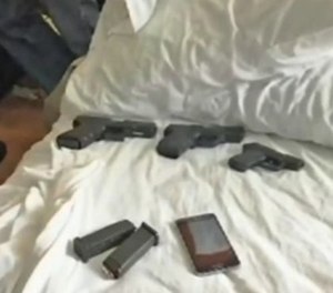 Detectives searched a motel room and recovered the deputy's gun, a second gun reported stolen and a third weapon from an unknown source.