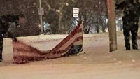 Photo: EMS providers pick up fallen American flag in snowstorm