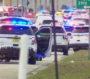 A suspect being booked into prison pulled a gun on deputies and jail staff. (Photo/Screenshot)