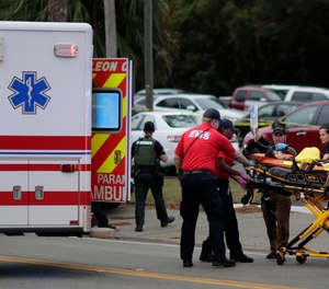 A person is transported from scene of a shooting, Friday, Nov. 2, 2018, in Tallahassee, Fla. (Tori Schneider/Tallahassee Democrat via AP)