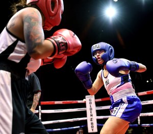 Los Angeles Police Officer Deirdre Fonseca, right, sizes up her opponent, Los Angeles County Sheriff’s Deputy Destiny Moreno. (Photo/TNS)