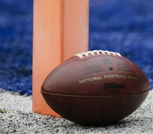 A football sits near the pylon marking the end zone as teams warms up before an NFL football game between the New York Giants and the San Francisco 49ers Sunday, Nov. 16, 2014, in East Rutherford, N.J.