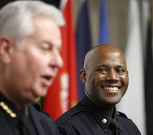 Incoming Police Chief Wendell Franklin (right) listen to remarks at a press conference announcing his appointment. Franklin will be Tulsa's first black police chief. (Photo/TNS)