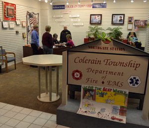 Colerain Fire Captain Roger Sauerwein and his wife, firefighter/paramedic Pat Sauerwein help staff the Northgate Station. Here, a group of mall walkers stop to talk and have a blood pressure check during their daily workout.